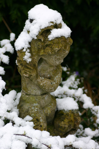 Stone Statue with snow